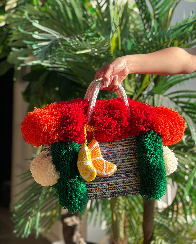 Boucle Knot Basket Bag with Playful Oversized Pompoms and Hand-Knit Charm